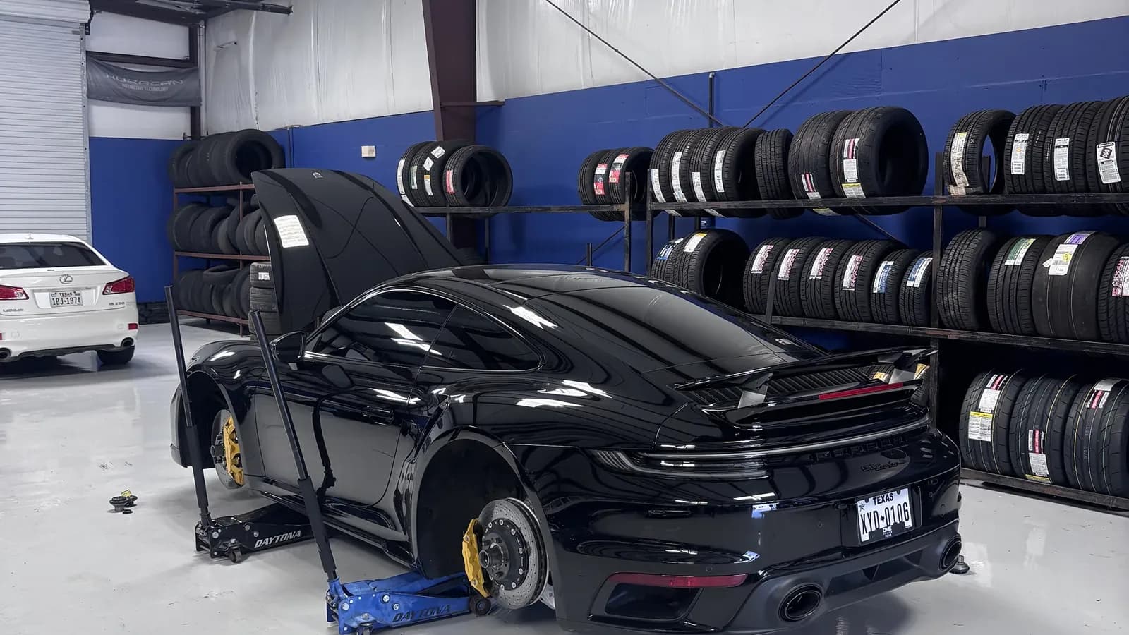 Performance vehicle receiving service inside Habibi Tires & Wheels